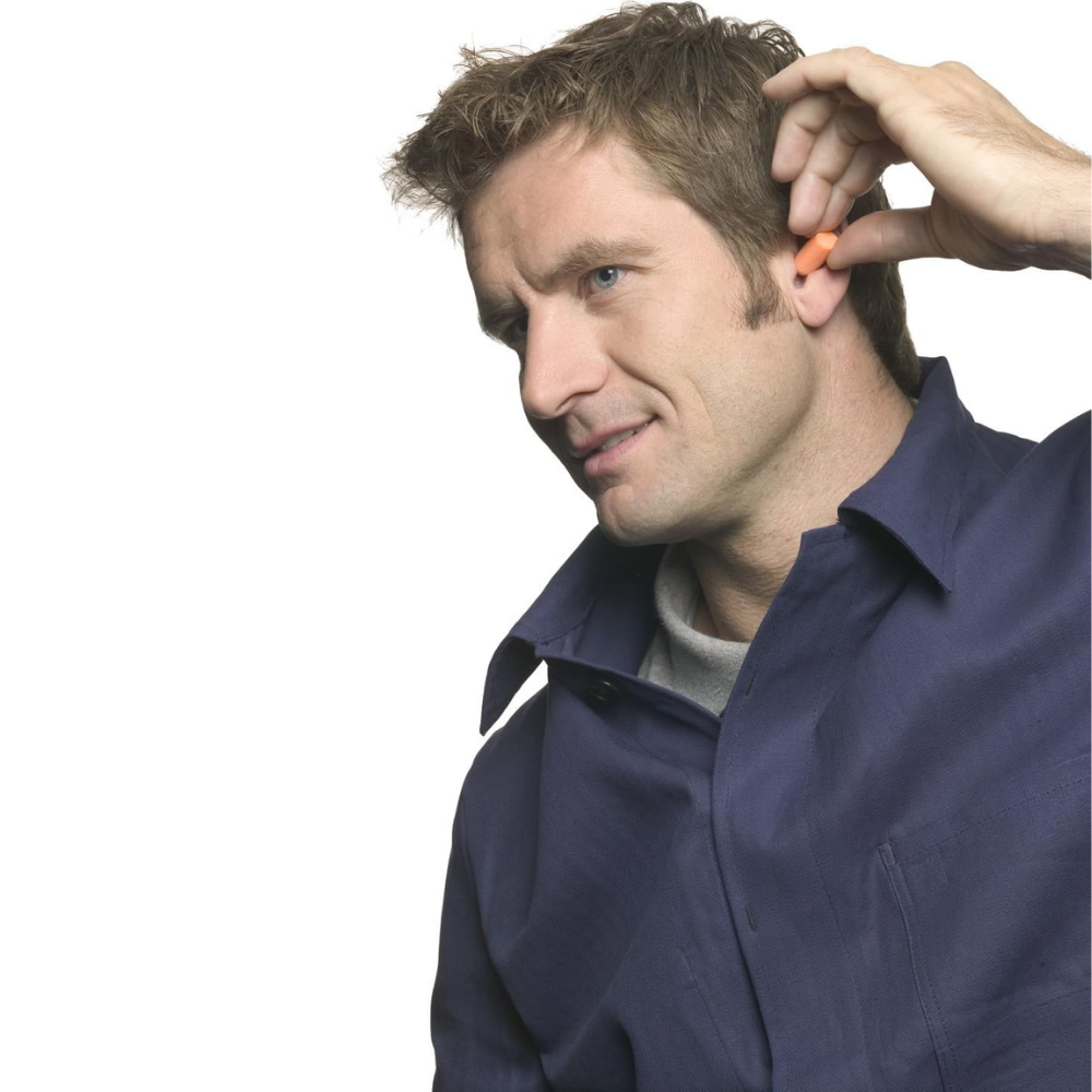 Foam earplugs worn for noise reduction during sleep or travel