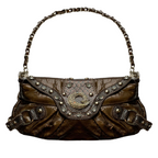 Small faux leather purse with jewel accents and decorative center ornament