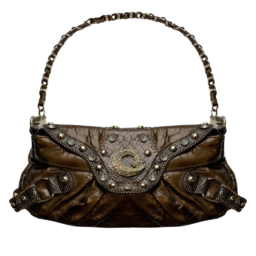 Small faux leather purse with jewel accents and decorative center ornament