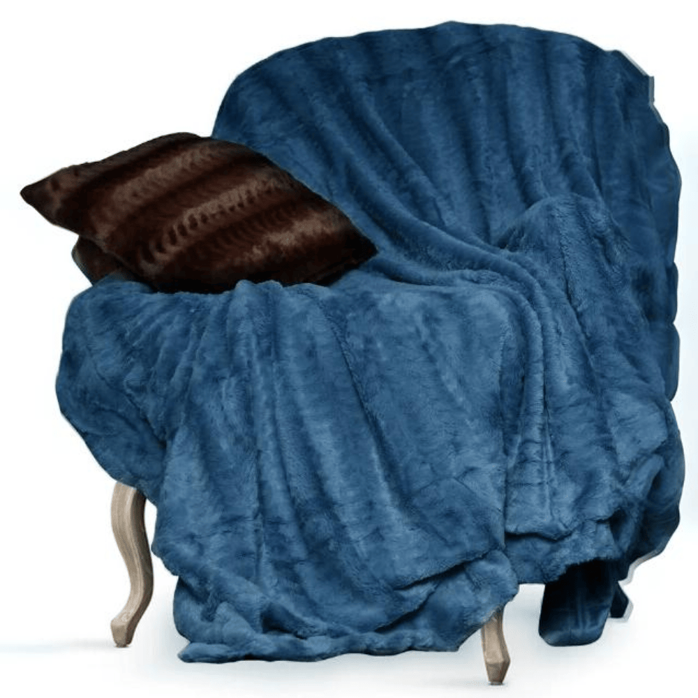 Soft faux fur throw blanket creating a warm and inviting atmosphere Blue on Chair