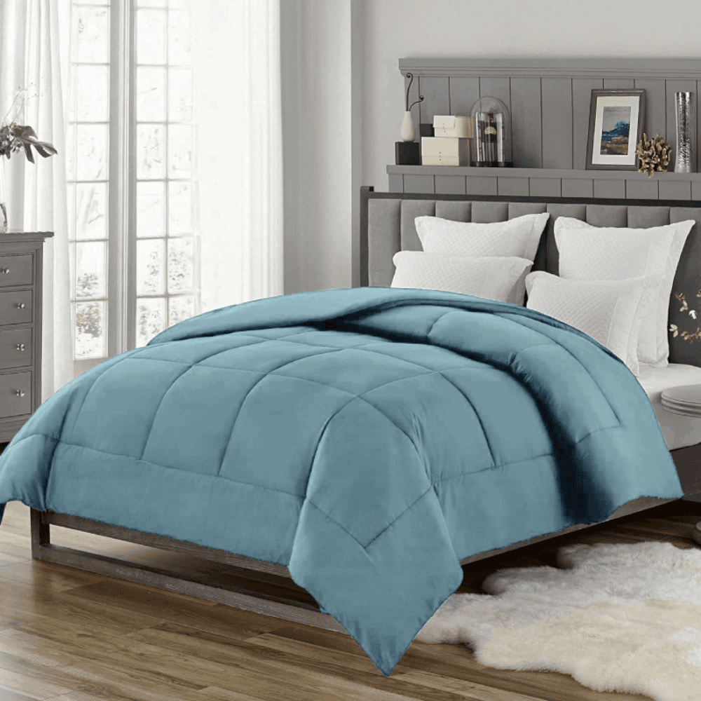 Classic light down alternative comforter displayed on a neatly made bed Blue Dusk