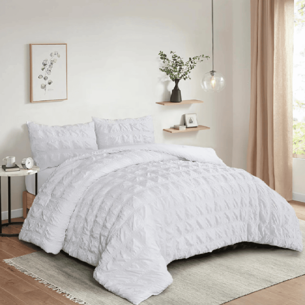 Wrinkle-resistant seersucker comforter set arranged for effortless everyday comfort White