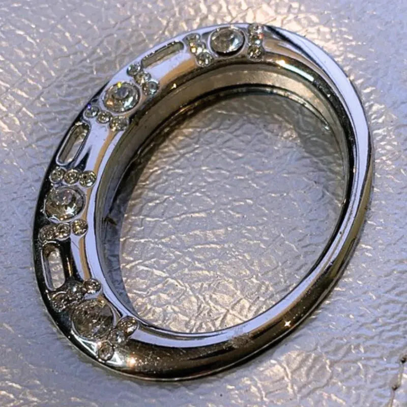 Silver clutch purse with elegant oval pattern for formal occasions