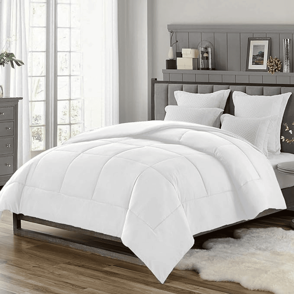 Soft microfiber down alternative comforter arranged for a calm sleep environment White